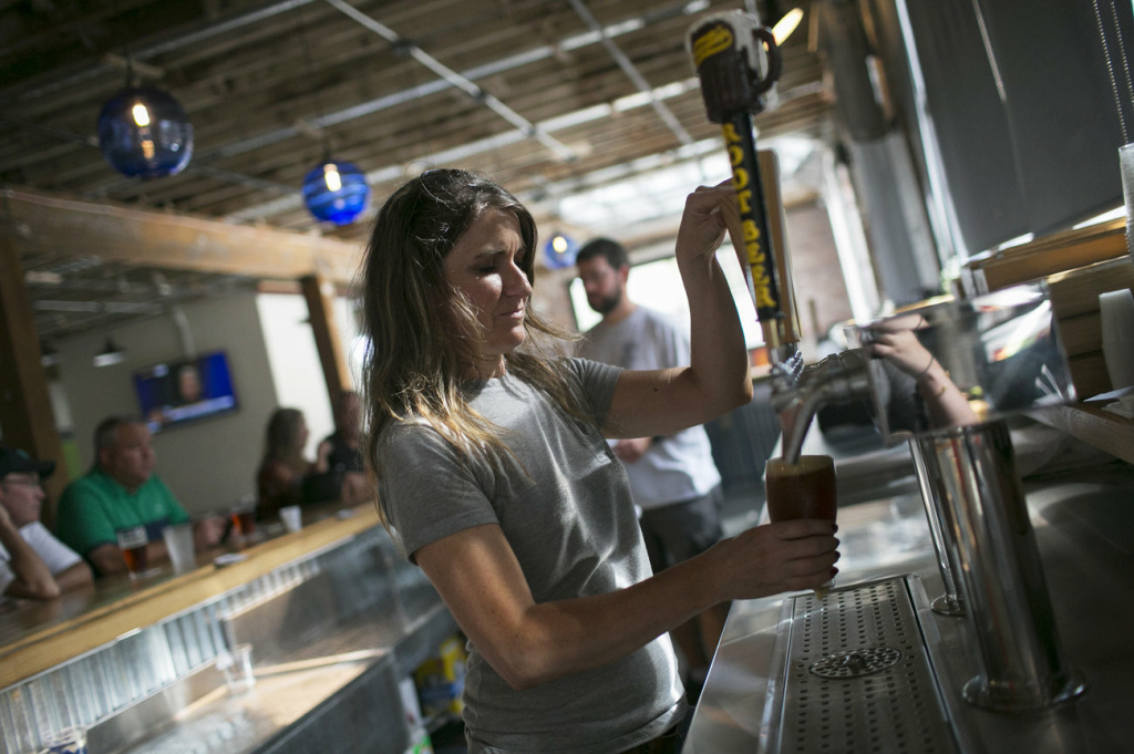 Molly Mattin pours beer at Mother Stewart's Brewing in Springfield. The new brewery, located in an old warehouse space, is part of the city's downtown revival which includes new shops and a farmer's market. Molly Mattin pours beer at Mother Stewart's Brewing in Springfield. The new brewery, located in an old warehouse space, is part of the city's downtown revival which includes new shops and a farmer's market.