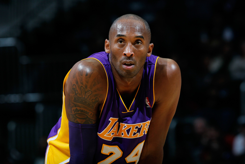 Los Angeles Lakers v Atlanta Hawks Kobe Bryant #24 of the Los Angeles Lakers stands during a free throw against the Atlanta Hawks at Philips Arena on December 16, 2013 in Atlanta, Georgia. NOTE TO USER: User expressly acknowledges and agrees that, by downloading and or using this photograph, User is consenting to the terms and conditions of the Getty Images License Agreement.