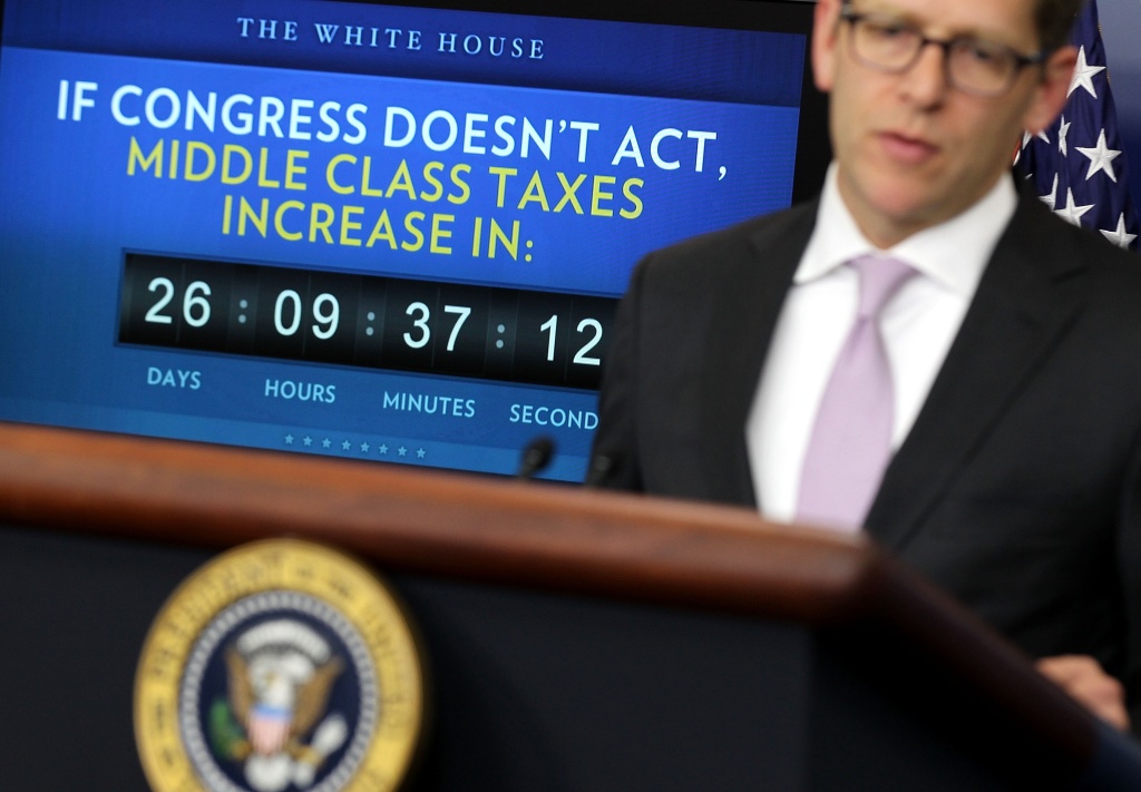 Payroll tax clock. White House Press Secretary Jay Carney speaks during the daily briefing after U.S. President Barack Obama delivered a statement urging Republicans in Congress to join Democrats to ensure taxes don't go up on middle class families in the Brady Briefing Room of the White House on December 5, 2011 in Washington, DC.