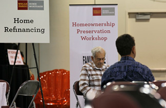 Homeowners wait to meet with Wells Fargo employees during a free workshop for customers who are facing mortgage payment challenges April 26, 2010 at the Oakland Convention Center in Oakland, California. Over 1,000 people who are in risk of slipping into foreclosure were scheduled to attend the mortgage workshop in hopes of getting loan modifications to avoid losing their homes.