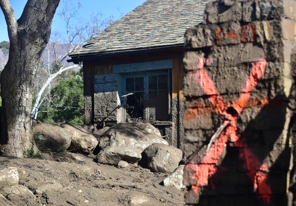 US-WEATHER-MUDSLIDES A red X is painted on a hose damaged by mud and debris in Montecito, California January 12, 2018.