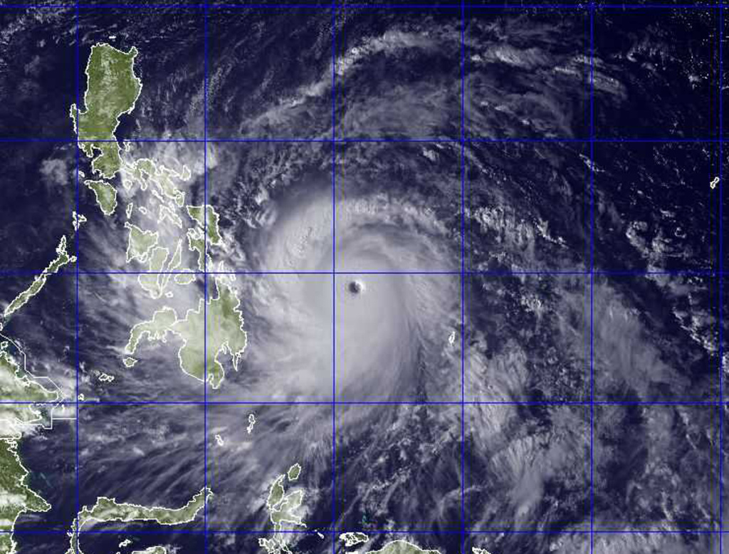 This image provided by the U.S. Naval Research Lab shows Typhoon Haiyan taken by the NEXSAT satellite Thursday Nov. 7, 2013 at 2:30 a.m. EDT. Gorvernment forecasters said Thursday that Typhoon Haiyan was packing sustained winds of 215 kilometers (134 miles) per hour and ferocious gusts of 250 kph (155 mph) and could pick up strength over the Pacific Ocean before it slams into the eastern Philippine province of Eastern Samar on Friday. (AP Photo/US Naval Research Lab)