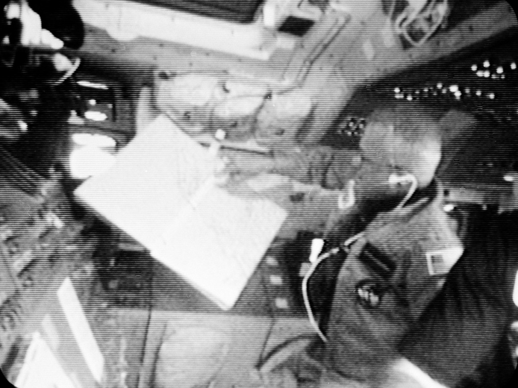 ap_840204021-a12d582a7af99013a961fab2a28f7aa31650e08c-s1200.jpg McCandless, mission specialist aboard the shuttle Challenger in February 1984, looks at a map showing the path of the spaceship.