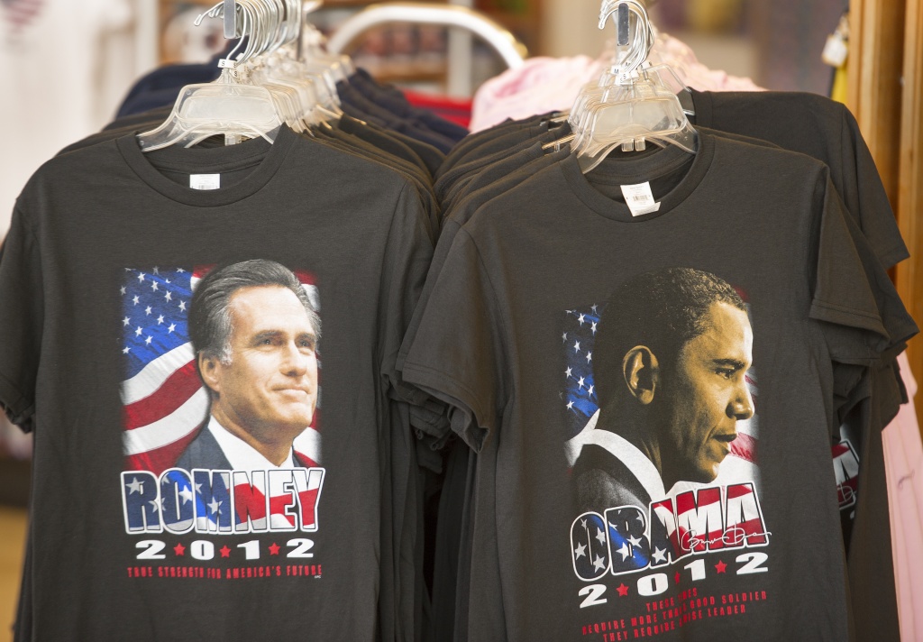 US-VOTE-2012-ROMNEY-OBAMA T-shirts bearing the images of Republican presidential candidate Mitt Romney (L) and US President Barack Obama for sale are seen at a retail shop inside Dulles International Airport near Washington, DC, September 17, 2012 in Chantilly, Virginia.