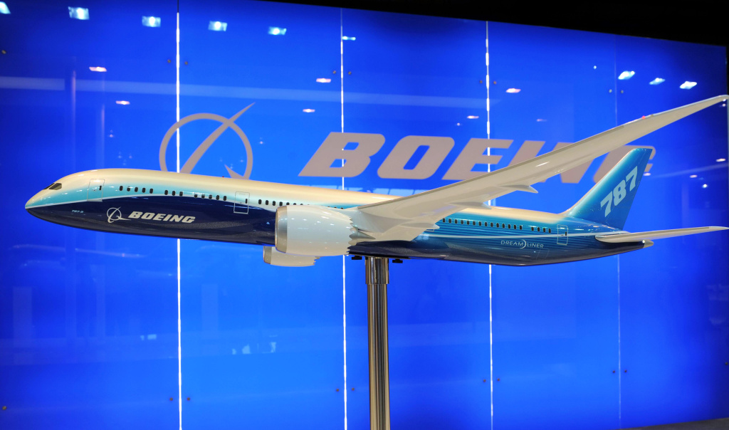 A model display of a Boeing 787 Dreamlin A model display of a Boeing 787 Dreamliner is exibited at the Singapore Airshow in Singapore on February 14, 2012. Boeing and Indonesian carrier Lion Air formally signed a 22.4 billion USD deal for 230 aircraft, the single largest contract in commercial aviation history.