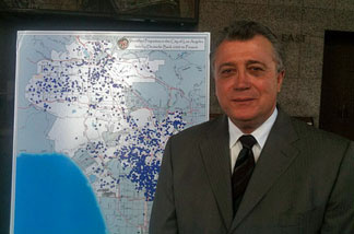 Los Angeles City Attorney Carmen Trutanich stands by map of Deutsche Bank-controlled properties in Los Angeles.