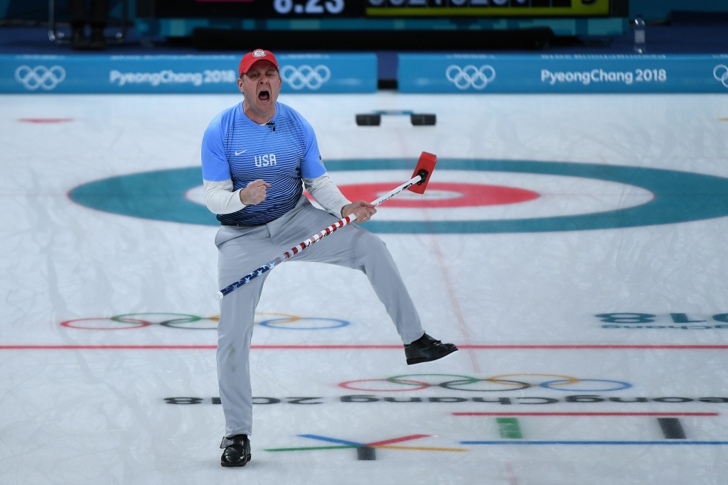 TOPSHOT-CURLING-OLY-2018-PYEONGCHANG-USA-SWE TOPSHOT - USA's John Shuster celebrates a point during the curling men's gold medal game between the USA and Sweden during the Pyeongchang 2018 Winter Olympic Games at the Gangneung Curling Centre in Gangneung on February 24, 2018. / AFP PHOTO / WANG Zhao (Photo credit should read WANG ZHAO/AFP/Getty Images)
