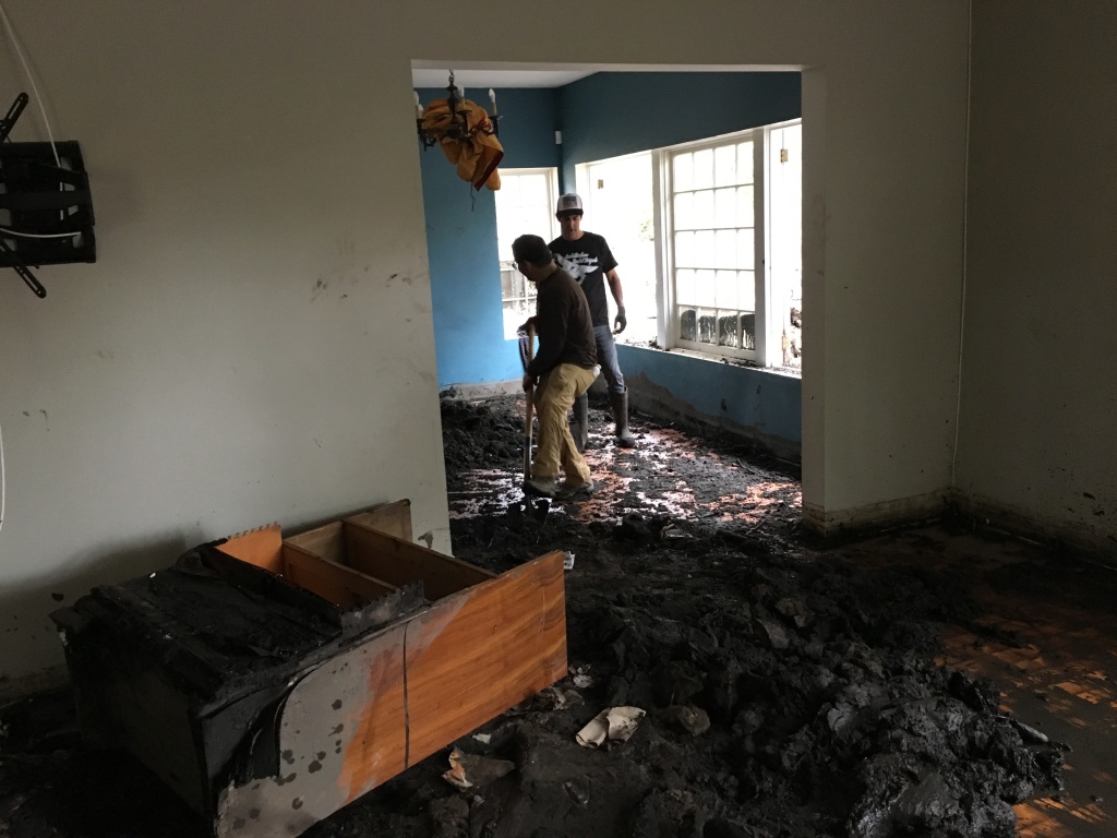 Jed Hirsh of Summerland and Josiah Hamilton of Montecito dig out the dining room of Peri Thompson's Montecito, Calif. house. Jed Hirsh of Summerland and Josiah Hamilton of Montecito dig out the dining room of Peri Thompson's Montecito, Calif. house.