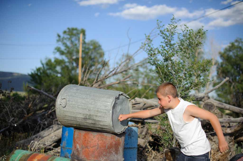 Instagram photographer Vinny punches a trashcan behind his aunt's home in northern New Mexico. Juvenile Court ordered that he live with his paternal aunt after his release from juvenile detention. He was incarcerated at age 13 for stabbing his mother's assailant.