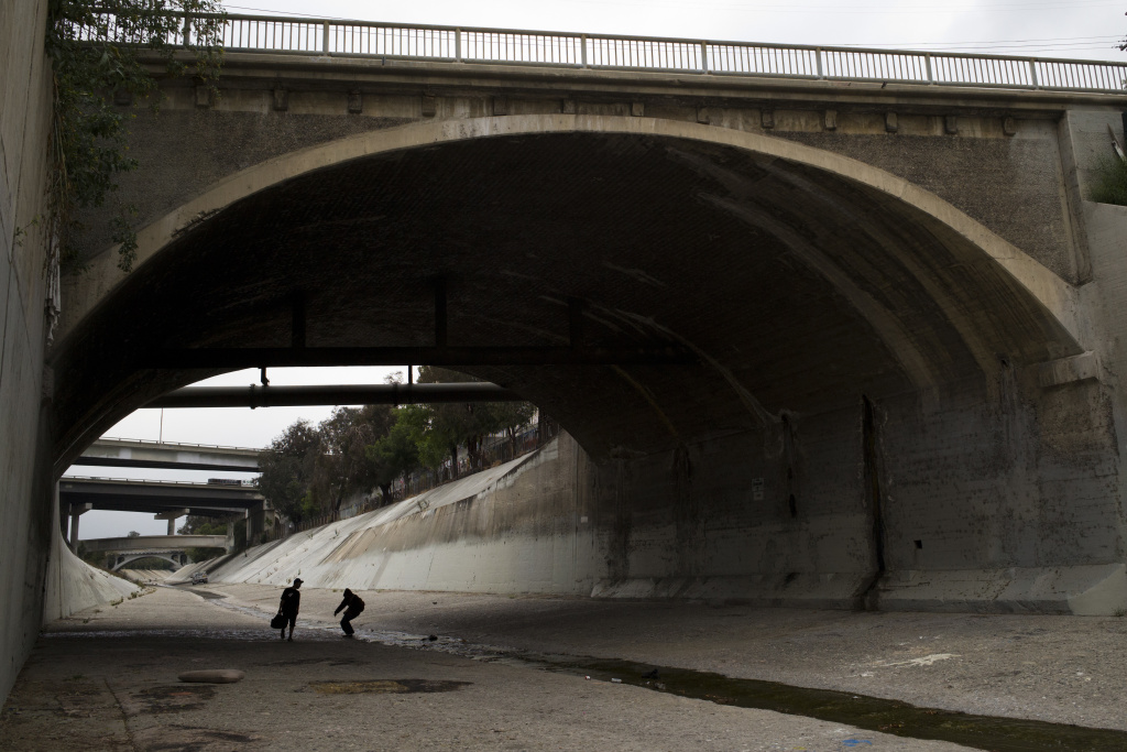 Hobo Graffiti Two homeless men walk under a bridge along the Los Angeles River, where almost extinct forms of American hieroglyphics known as hobo graffiti were discovered.