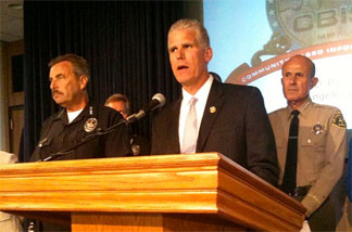 The head of the California Department of Corrections Matthew Cate is flanked by LAPD Chief Charlie Beck and L.A. County Sheriff Lee Baca.