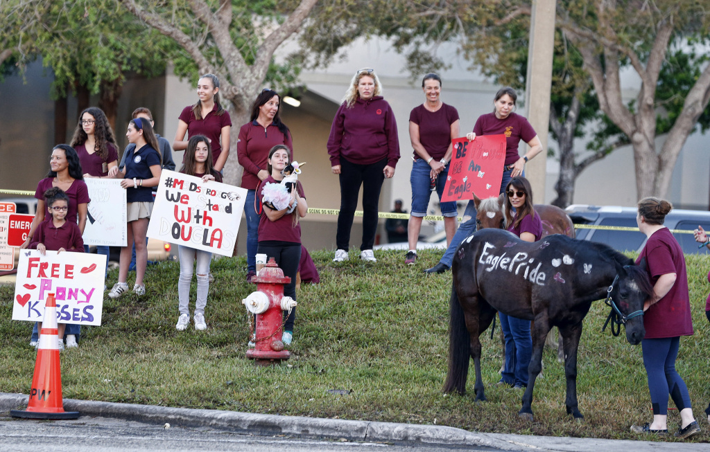 US-SCHOOL-SHOOTING Marjory Stoneman Douglas High School staff, teachers and students return to school greeted by police and well wishers in Parkland, Florida on February 28, 2018.
