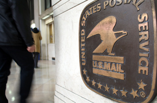 File photo: People use mail services at the U.S. Post Office in the James Farley Building May 12, 2008 in New York City.