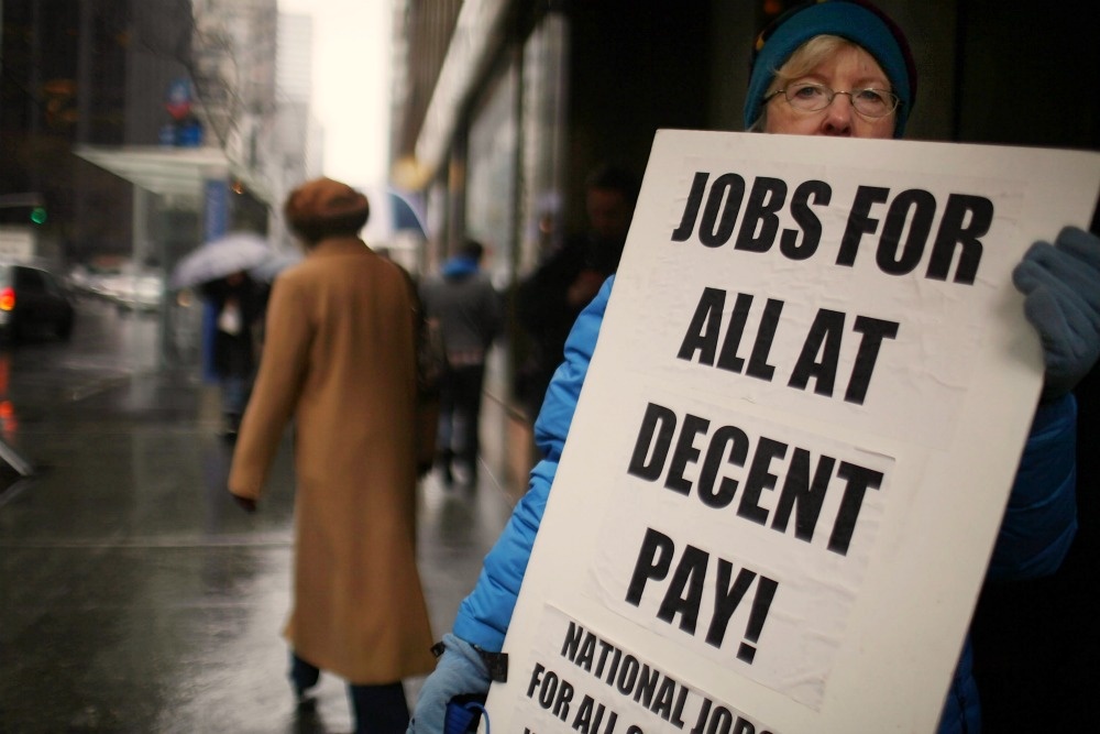 Sheila Collins protests with others outside of U.S. Senator Charles Schumer`s office to demand more jobs on April 1, 2011 in New York City.