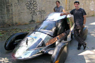Team Edison2's Oliver Kuttner (left) and Brad Jaeger, one of the team's professional race car drivers, with the Very Light Car that won the mainstream class of the X Prize competition.