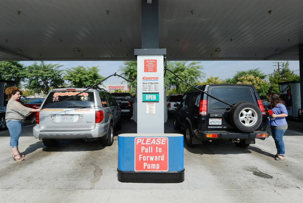 Customers gas up their car at a Costco store in Burbank.