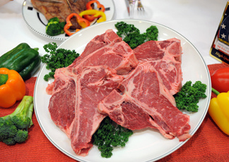 Imported T-bone steak from the US are seen during a food-tasting event at a market in Seoul on July 14, 2010.