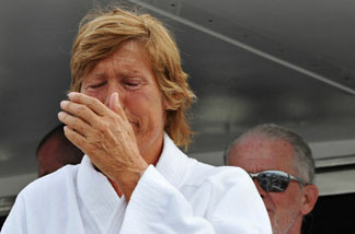 FILE: In this handout provided by Florida Keys News Bureau, Diana Nyad reacts as she speaks to reporters and fans after arriving back in Florida, following the 61-year-old marathon swimmer's failed attempt to swim from Cuba to the Florida Keys August 9, 2011 in Key West, Florida.