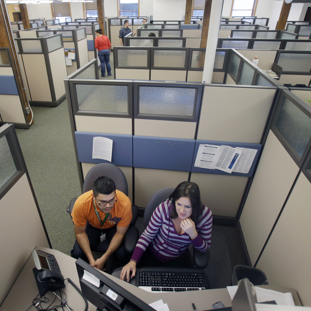 Workers at a Minnesota health care exchange prepare for opening day on Tuesday.