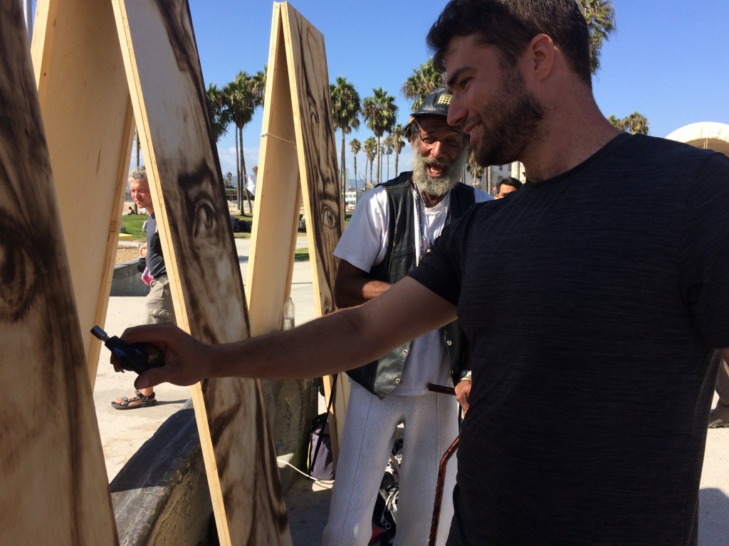 Aronson loves interacting with his models and also the passerby’s who are curious about his work. Aronson loves interacting with his models and also the passerby’s who are curious about his work.