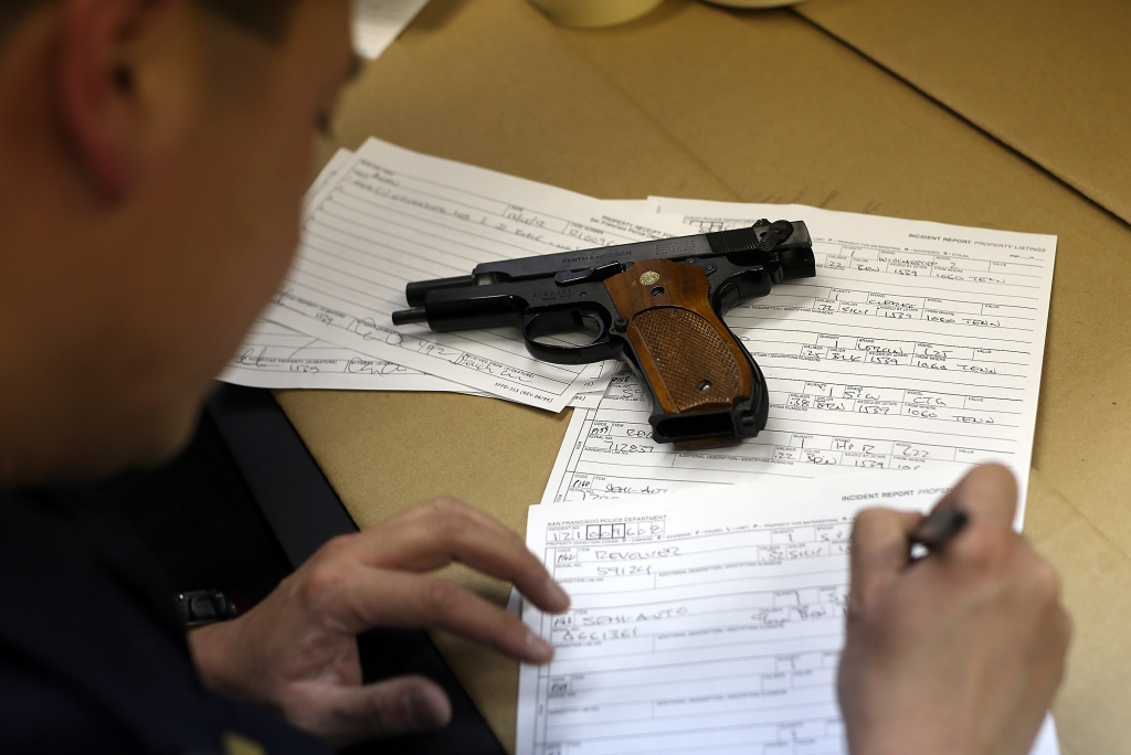 Anonymous Gun Buy Back Program In San Francisco A San Francisco police officer documents a gun that is being surrendered during a gun buy back program on December 15, 2012 in San Francisco, California. The San Francisco police department held a one-day gun buy back event that paid $200 per gun turned in. A better than expected crowd resulted in payback money running out and vouchers were issued to collect money within a week. Over 200 guns were collected.