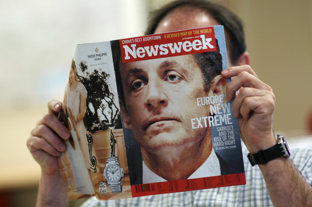 A man reads the October 4, 2010 issue of A man reads the October 4, 2010 issue of the US weekly magazine Newsweek with the headline