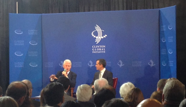 Former President Bill Clinton and Los Angeles Mayor Eric Garcetti discuss how cities can pay for infrastructure projects during an event for the Clinton Global Initiative at City Hall.