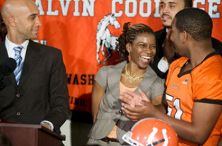 Natalie Randolph is the center of attention at a news conference held by Washington, D.C., Mayor Adrian Fenty (left). She'll coach the Coolidge High Colts this fall.