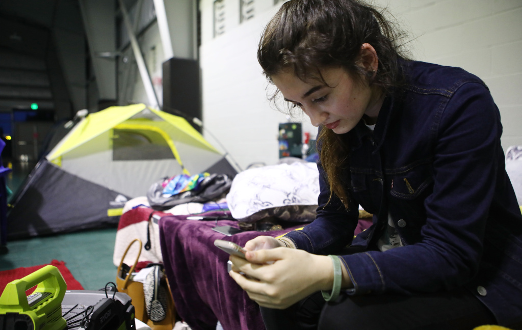 Hawaii's Kilauea Volcano Erupts Forcing Evacuations Evacuee Taylor Burns checks her phone in the emergency shelter where she is staying at the Pahoa Community Center on Hawaii's Big Island on May 5, 2018 in Pahoa, Hawaii. A magnitude 6.9 earthquake struck the island May 4 along with new eruptions from the Kilauea volcano.