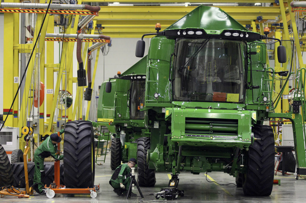 Employees fit a tire to a John Deere W540 combine inside the company's Domodedovo manufacturing center near Moscow, Russia. The U.S. trade deficit narrowed for a second month in March 2013 as the daily flow of imported crude oil dropped to the lowest level in 17 years. The deficit with China hit a three-year low. The Commerce Department said Thursday the trade deficit decreased to $38.8 billion, an 11 percent drop from February's $43.6 billion.
Employees fit a tire to a John Deere W540 combine inside the company's Domodedovo manufacturing center near Moscow, Russia. The U.S. trade deficit narrowed for a second month in March 2013 as the daily flow of imported crude oil dropped to the lowest level in 17 years. The deficit with China hit a three-year low. The Commerce Department said Thursday the trade deficit decreased to $38.8 billion, an 11 percent drop from February's $43.6 billion.