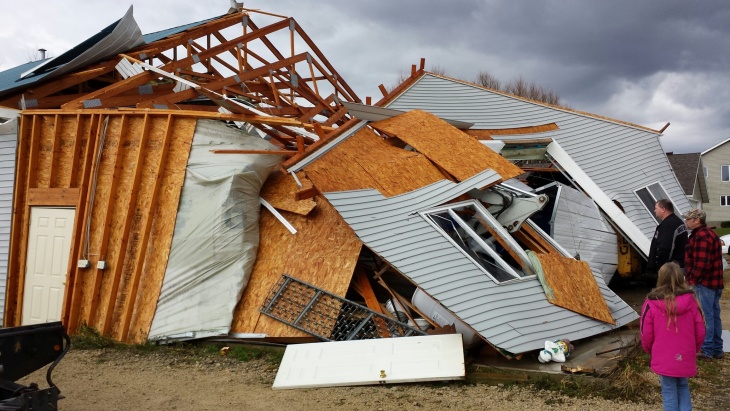 A firefighter searches through debris after a tornado struck on November 17, 2013 in Washington, Illinois. Several tornadoes touched down across the Midwest today with at least three people reported dead in Illinois. 