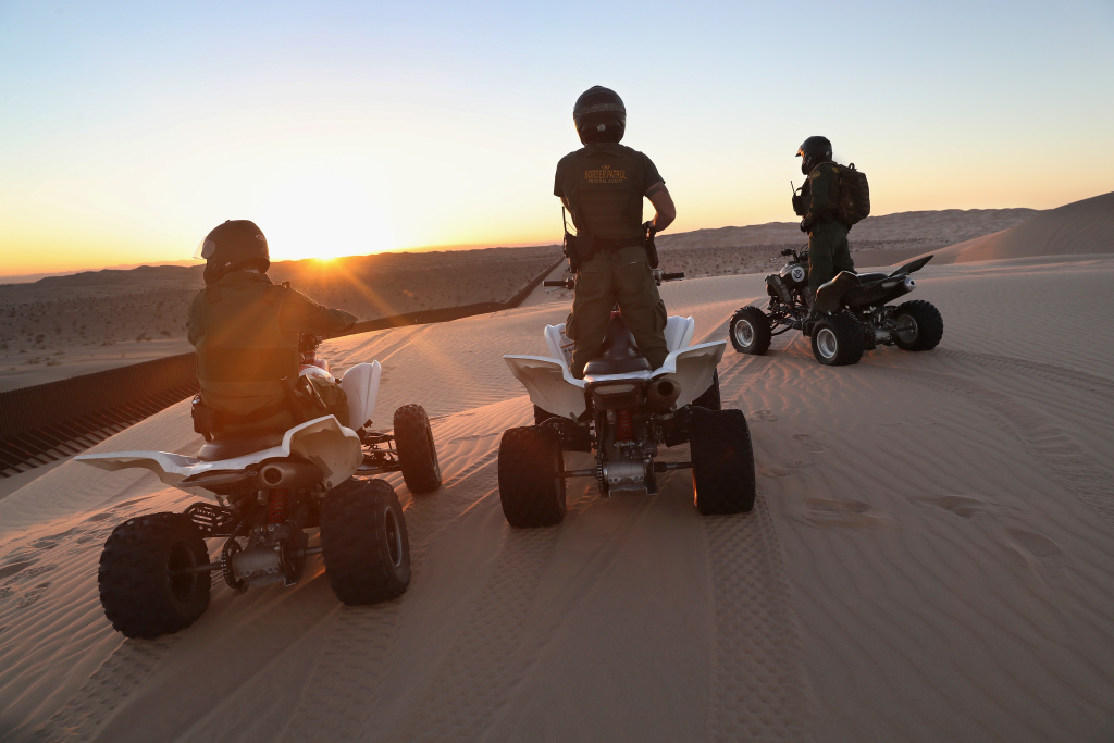 Border Patrol Agents Monitor Fence On U.S.-Mexico Border U.S. Border Patrol agents on ATVs monitor the U.S.-Mexico border fence at the Imperial Sand Dunes on November 17, 2016 near Felicity, California. Border Patrol agents say they catch groups of illegal immigrants and drug smugglers crossing in from Mexico there daily.