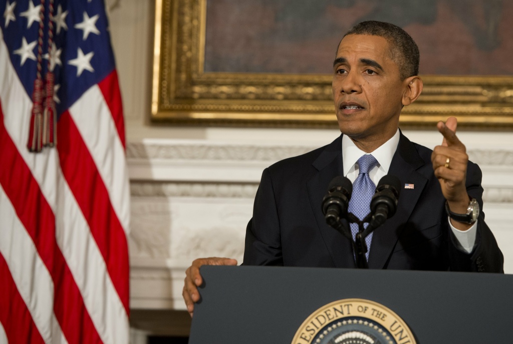 US-POLITICS-ECONOMY-BUDGET US President Barack Obama speaks about the reopening of the US government following a shutdown, in the State Dining Room of the White House in Washington, DC, on October 17, 2013. Obama warned Thursday that America's political dysfunction had encouraged its enemies and depressed its friends, and said the crisis had left 'no winners' in Washington. Obama called on warring politicians to come together to pass a long term budget and to give up the 'brinksmanship' that threatens the economy and squandered the trust of the American people.