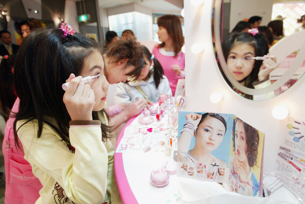 Cosmetic Products For Children Launched In Japan A Japanese girl tries out cosmetics at a counter in a store of the Japanese toy maker Bandai Co., Ltd on March 20, 2004 in Tokyo, Japan.
