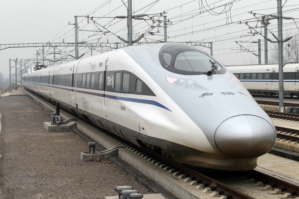 CHINA-RAIL-TRANSPORT The high speed train that runs on the new 2,298-kilometre (1,425-mile) line between Beijing and Guangzhou runs into Xuchang East Station in Xuchang, central China's Henan province on December 26, 2012.