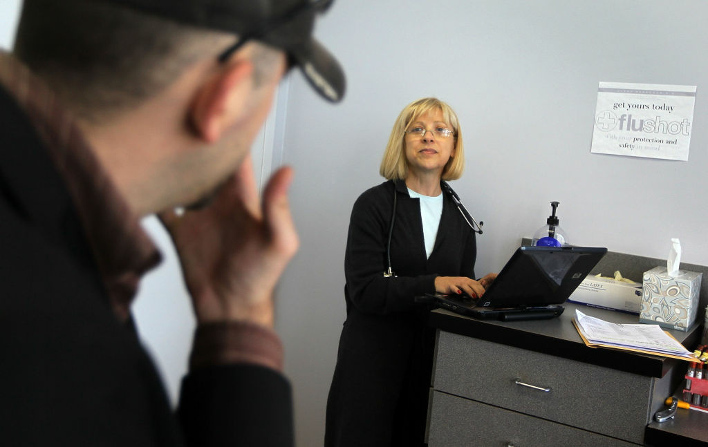Medical Clinic Starts Process Of Digitizing Records Dr. Klara Gershman, MD, uses a laptop computer to enter information about her patient, Doniel Adivi, on February 16, 2010 in Miami Beach, Florida. Dr. Gershman is starting the process of shifting her office to a computer system that will store the information of her patients as South Florida is set to receive $8.5 million in federal stimulus money to help doctors and other healthcare providers convert to electronic record keeping. The Obama administration included electronic record keeping in the stimulus package as they see it as one way to help control costs around the nation in the health care business.