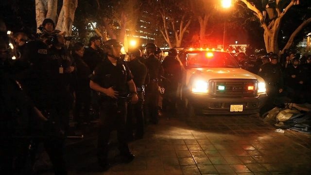 Occupy is Out at City Hall Police raided the Occupy encampment at City Hall arresting 200, and little of the protesters' preparations came to use in the largely peaceful raid.