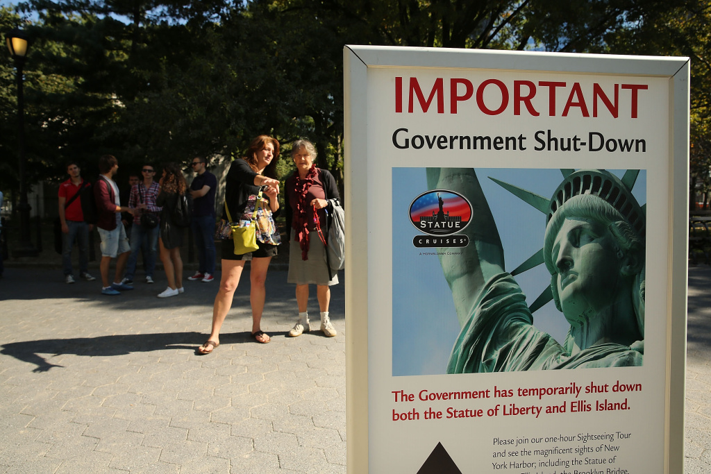 Government Shutdown Closes Statue Of Liberty People look at a sign for informing that the Statue of Liberty is closed due to the government shutdown in Battery Park on October 1, 2013 in New York City. Federal museums and parks across the nation are closed starting today due to a government shutdown for the first time in nearly two decades. The Dow Jones industrial average, the S&P 500 and the Nasdaq all rose slightly higher in early trading Tuesday morning.