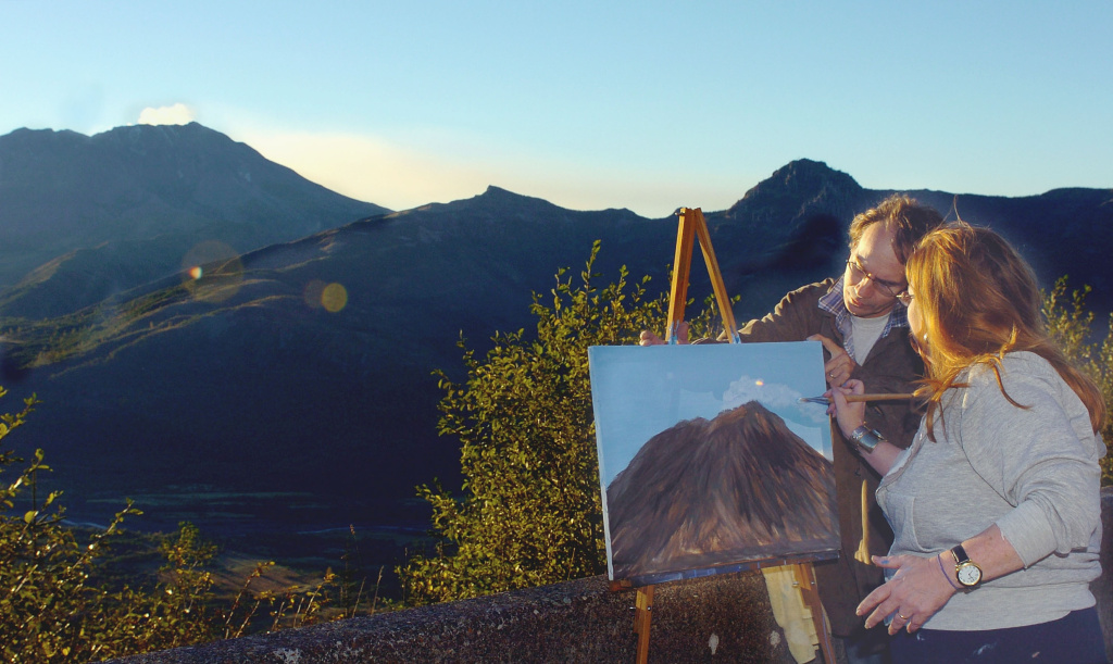 Mount St. Helens Eruption Watch Continues Teri Dewey, right, assisted by her husband, Joe Dewey, adds a steam plume to her painting of Mount St. Helens, after setting up her easel at Elk Creek Overlook in Washington on October 14, 2004.
