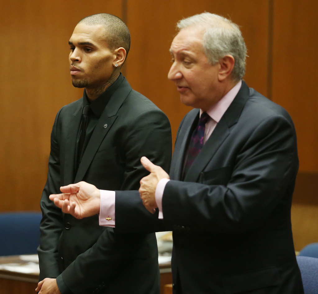 Recording artist Chris Brown (L) and his attorney Mark Geragos appear in Los Angeles court on November 20, 2013 in Los Angeles, California. Brown was ordered to 90 days at an inpatient center, random drug testing and 24 hours of weekly community service. Brown was arrested last month for misdemeanor assault in Washington, DC and was already on probation for a felony domestic violence charge after a 2009 incident with then-girlfriend Rihanna.
