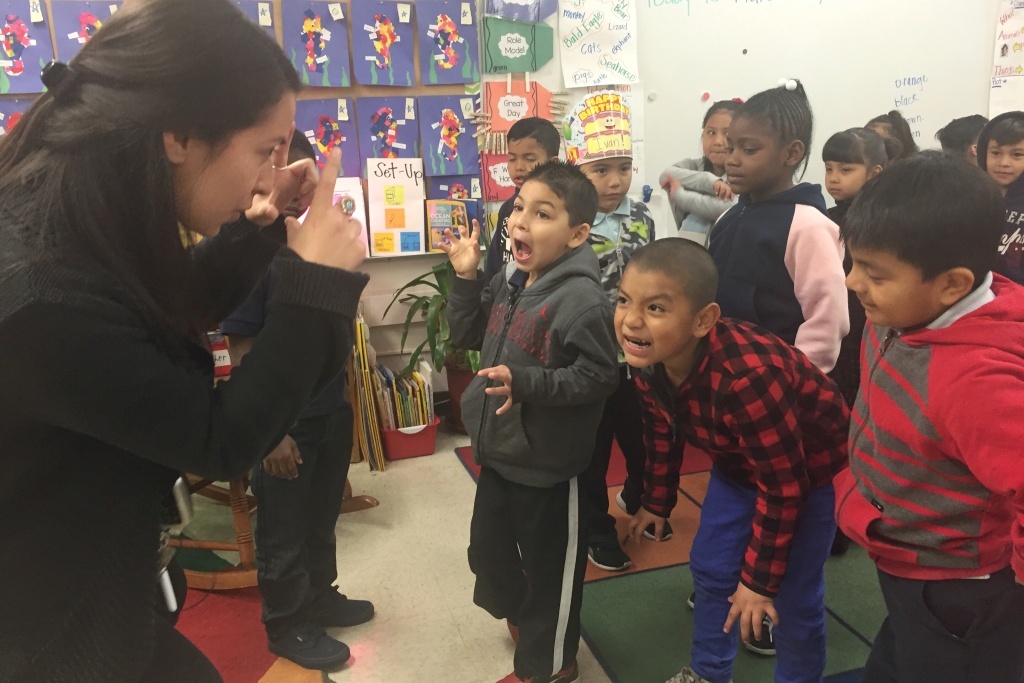 Joyner Turnaround Arts Teacher Maria Ortega uses an arts integration technique with her kindergarteners to help reinforce vocabulary about bears.