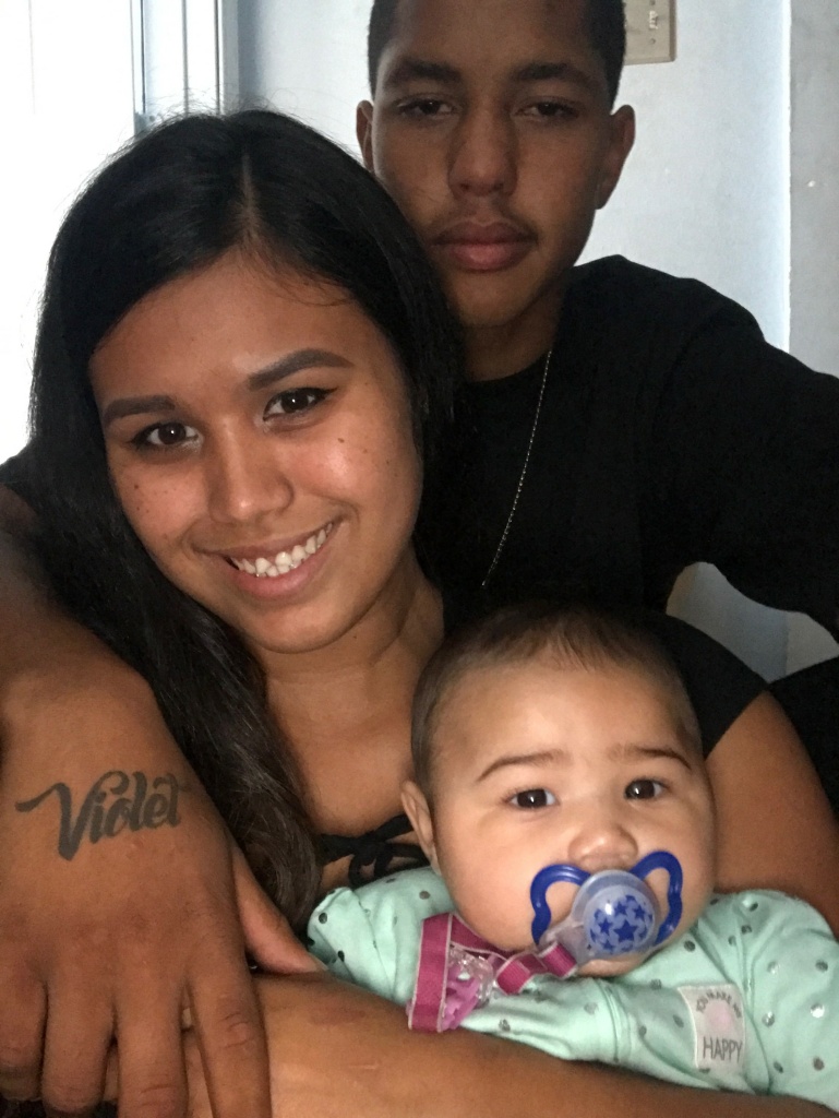 Anthony Weber with Stephanie Valencia and their daughter Violet.