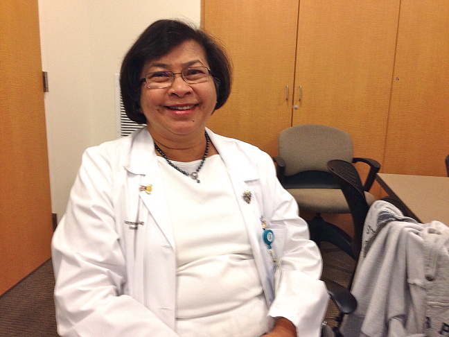 Chelsea Kim, a volunteer for Asians Miracle Marrow Matches, talks to Joseph Chiew during the LA Korean Festival about the need for ethnic bone marrow donors.
