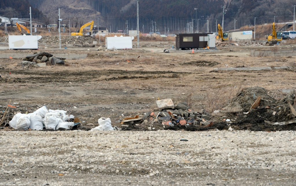 JAPAN-DISASTER-ANNIVERSARY-MEDIA This picture taken on February 20, 2013 shows the same area where AFP photographer Fred Dufour took a photo on March 18, 2011 showing debris and damage in the tsunami hit area of Minamisanriku, Japan. U.S. officials said Friday that a fishing boat that washed ashore in Northern California is the first debris to reach the state that's been confirmed as having come from the Japanese tsunami. (Photo credit TOSHIFUMI KITAMURA/AFP/Getty Images)