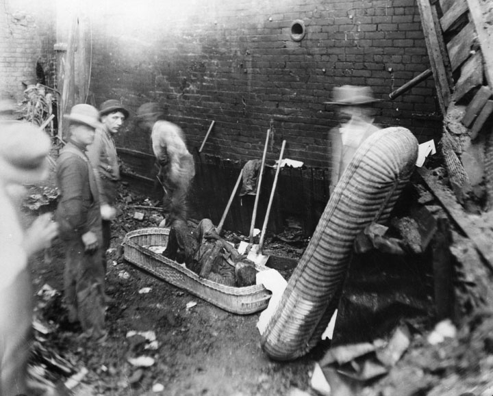 Recovery of victim from the rubble created by the 1910 bombing of the Los Angeles Times Building at First Street and Broadway. Recovery of victim from the rubble created by the 1910 bombing of the Los Angeles Times Building at First Street and Broadway.