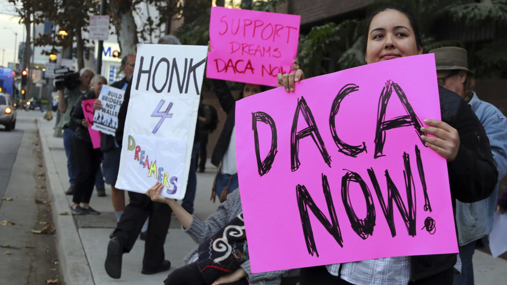 Demonstrators urging the Democratic Party to protect the Deferred Action for Childhood Arrivals Act (DACA) rally outside the office of California Democratic Sen. Dianne Feinstein in Los Angeles last week. Demonstrators urging the Democratic Party to protect the Deferred Action for Childhood Arrivals Act (DACA) rally outside the office of California Democratic Sen. Dianne Feinstein in Los Angeles last week.