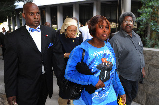 Wanda Johnson (2nd R), who is the mother of victim Oscar Grant, leaves a pretrial hearing for Johannes Mehserle, the former Bay Area Rapid Transit officer charged with murder in the shooting death of Grant in Oakland, California last year, at the Criminal Courts Building in Los Angeles on March 26, 2010.