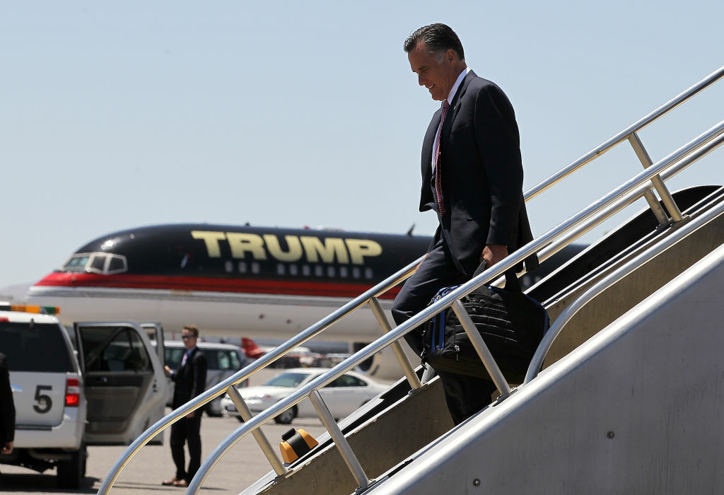 Mitt Romney Campaigns At Local Business In Las Vegas Republican presidential candidate, former Massachusetts Gov. Mitt Romney walks off of his campaign plane past Donald Trump's plane after landing at McCarran International Airport on May 29, 2012 in Las Vegas, Nevada.