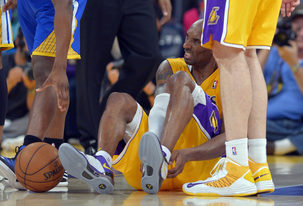 Warriors Lakers Basketball Los Angeles Lakers guard Kobe Bryant grimaces after being injured during the second half of their NBA basketball game against the Golden State Warriors, Friday, April 12, 2013, in Los Angeles.