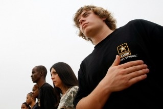 File photo: Soldier-recruits for the active-duty Army, National Guard and Army Reserve, including Logan Bilyeu (R) take part in a swearing-in ceremony at the Jefferson Memorial October 4, 2007 in Washington, DC.